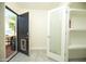 Entryway with access to the backyard, a glass door, and storage shelves at 1512 E Cypress St, Phoenix, AZ 85006