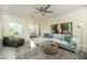 Bright living room with modern ceiling fan, stylish furnishings, and plenty of natural light at 1512 E Cypress St, Phoenix, AZ 85006