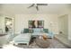 Comfortable living room with stylish decor, modern ceiling fan, and abundant natural light at 1512 E Cypress St, Phoenix, AZ 85006