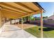 The backyard includes a covered patio and a rock area at 1610 N Apache Dr, Chandler, AZ 85224