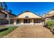 The backyard features a covered patio and synthetic grass at 1610 N Apache Dr, Chandler, AZ 85224