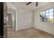 This bedroom offers new flooring and natural light at 1610 N Apache Dr, Chandler, AZ 85224