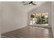 The bedroom offers natural light from the backyard view, wood floors, and neutral colors at 1610 N Apache Dr, Chandler, AZ 85224