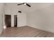 Bedroom featuring a ceiling fan and light wood flooring, offering a modern and inviting atmosphere at 1610 N Apache Dr, Chandler, AZ 85224