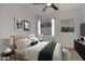 Comfortable bedroom with neutral colors, stylish decor, and a large window for ample sunlight at 1610 N Apache Dr, Chandler, AZ 85224