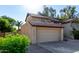 Charming two-story home with a tile roof, two car garage and well-maintained landscaping at 1610 N Apache Dr, Chandler, AZ 85224