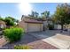 Charming two-story home with a tile roof, two car garage and well-maintained landscaping at 1610 N Apache Dr, Chandler, AZ 85224