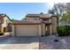 Charming two-story home with a tile roof, two car garage and well-maintained landscaping at 1610 N Apache Dr, Chandler, AZ 85224
