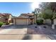 Charming two-story home with a tile roof, two car garage and well-maintained landscaping at 1610 N Apache Dr, Chandler, AZ 85224