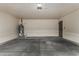 This garage has a door to the house and a water heater at 1610 N Apache Dr, Chandler, AZ 85224