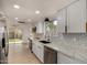 Remodeled kitchen featuring white cabinets, stainless steel appliances, and an eat-in area at 1610 N Apache Dr, Chandler, AZ 85224
