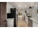 Updated kitchen with stainless steel appliances, backsplash, and eat-in area at 1610 N Apache Dr, Chandler, AZ 85224