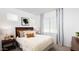Bedroom featuring a comfortable bed, neutral tones, and a relaxing atmosphere at 17382 W Artemisa Ave, Surprise, AZ 85387