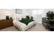 Cozy bedroom with neutral tones, a comfortable bed, and a relaxing atmosphere at 17382 W Artemisa Ave, Surprise, AZ 85387