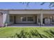 Shaded back patio offers an entertainment space overlooking the low maintenance artificial lawn at 17770 N 66Th Ln, Glendale, AZ 85308