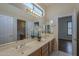 Bathroom featuring a double sink vanity, and natural light at 17770 N 66Th Ln, Glendale, AZ 85308
