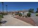 A wide view of a well-maintained single-Gathering home with desert landscaping at 17770 N 66Th Ln, Glendale, AZ 85308