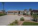 Charming single-story home with a well-manicured front yard and large driveway at 17770 N 66Th Ln, Glendale, AZ 85308