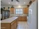Spacious kitchen with center island, bright cabinets, and appliances, offering ample counter space at 17770 N 66Th Ln, Glendale, AZ 85308