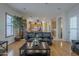 Open-concept living room showcasing hardwood floors, and views into the kitchen at 17770 N 66Th Ln, Glendale, AZ 85308