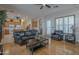 Spacious living area with hardwood floors, open layout, and adjacent kitchen, perfect for entertaining at 17770 N 66Th Ln, Glendale, AZ 85308