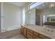 Beautiful bathroom with dual vanities, jacuzzi tub, and skylights for plenty of natural light at 17770 N 66Th Ln, Glendale, AZ 85308