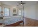 Spacious main bedroom with a fireplace, plantation shutters, and ensuite access at 17770 N 66Th Ln, Glendale, AZ 85308