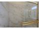 Shower with glass door and beautiful tile work at 17770 N 66Th Ln, Glendale, AZ 85308
