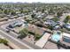 Expansive aerial view showing the neighborhood, featuring houses, pools, and desert landscaping at 18212 N 43Rd Pl, Phoenix, AZ 85032