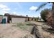 This grassy backyard includes shade trees and is ready for summer fun at 18212 N 43Rd Pl, Phoenix, AZ 85032