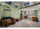 An expansive bonus room features unique floors, a skylight, and vintage furniture at 18212 N 43Rd Pl, Phoenix, AZ 85032