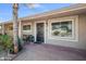 Inviting front entrance with a decorative door, brick walkway, and a cozy seating area at 18212 N 43Rd Pl, Phoenix, AZ 85032