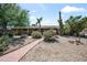 Charming single-story home featuring desert landscaping, a paved walkway, and a serene Southwest ambiance at 18212 N 43Rd Pl, Phoenix, AZ 85032