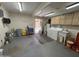 Open concept garage with laundry, work bench, access to backyard and patio at 18212 N 43Rd Pl, Phoenix, AZ 85032