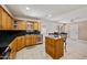 Traditional kitchen showcasing an island with seating, tile floors, stainless appliances, and ample cabinet space at 18212 N 43Rd Pl, Phoenix, AZ 85032