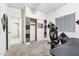 Bedroom featuring soundproofing, closet, and access to another room at 18333 N Presley Ln, Maricopa, AZ 85138