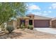 Charming single-story home with desert landscaping and a spacious two-car garage at 18333 N Presley Ln, Maricopa, AZ 85138
