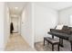 Hallway leading to the main door and a room with a piano and a bench at 18333 N Presley Ln, Maricopa, AZ 85138