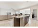 Stylish kitchen island with granite countertops seamlessly connecting to the living space at 18333 N Presley Ln, Maricopa, AZ 85138