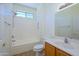 Bright bathroom featuring a shower-tub combination at 18651 N Salerno Ct, Surprise, AZ 85387