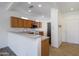 Bright kitchen with ample counter space, wooden cabinets, and modern appliances at 18651 N Salerno Ct, Surprise, AZ 85387