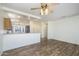 Spacious living area with wood-look flooring, open to the kitchen and dining areas at 18651 N Salerno Ct, Surprise, AZ 85387