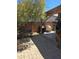 Outdoor patio area featuring a covered dining area, grill, and lush landscaping at 2125 E Danbury Rd, Phoenix, AZ 85022