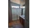 Bright bathroom featuring a glass-enclosed shower and a vanity with a sink at 2125 E Danbury Rd, Phoenix, AZ 85022