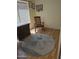 Bedroom with hardwood floors featuring a rocking chair and dresser at 2125 E Danbury Rd, Phoenix, AZ 85022