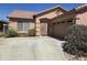Charming single-story home with desert landscaping, a tile roof, and a two-car garage at 2125 E Danbury Rd, Phoenix, AZ 85022