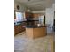 Kitchen featuring dark countertops, stainless steel appliances, and a kitchen island at 2125 E Danbury Rd, Phoenix, AZ 85022