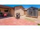 Spacious backyard with covered patio, outdoor grill, and storage shed offers outdoor living at 215 S 132Nd St, Chandler, AZ 85225