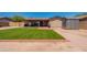 Backyard with artificial turf, patio, outdoor grill and storage shed in low maintenance setting at 215 S 132Nd St, Chandler, AZ 85225