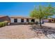 Charming single-story home featuring a well-manicured front yard, desert landscaping, and inviting curb appeal at 215 S 132Nd St, Chandler, AZ 85225